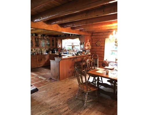 16 Blood Road Charlton, MA 01507 - Photo 14 of 22 a dining room with furniture and a floor to ceiling window