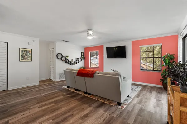 a living room with furniture and a flat screen tv