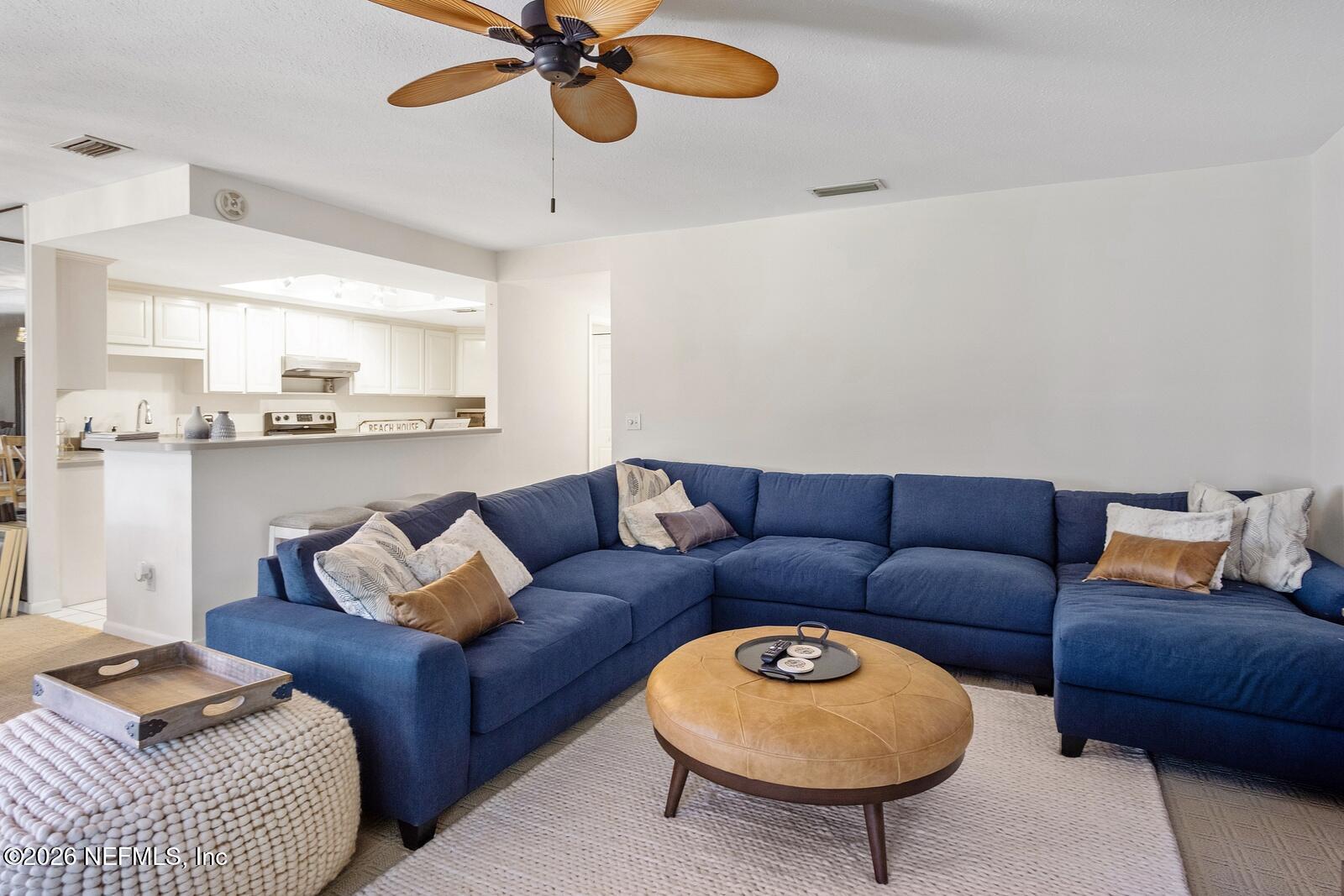 8012 Hollyridge Road, Unit 17U Jacksonville, FL 32256 - Photo 6 of 22 a living room with furniture and a lamp