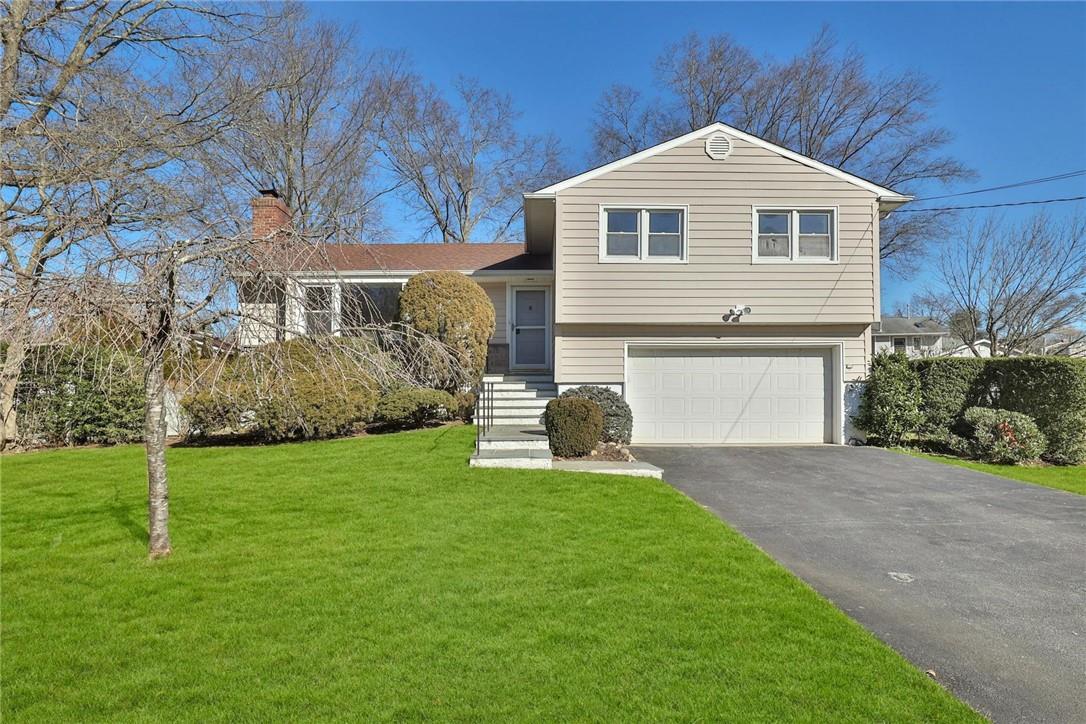 a front view of a house with a yard and porch