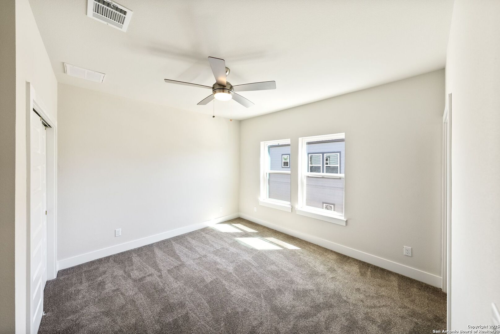 419 Ira Avenue, Unit 2101 San Antonio, TX 78209 - Photo 16 of 23 an empty room with windows and fan