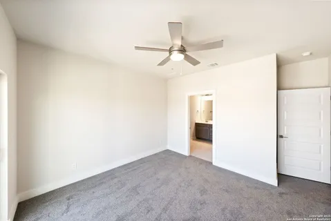 a view of a livingroom with a ceiling fan