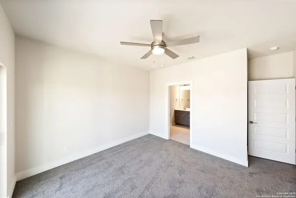 a view of a livingroom with a ceiling fan