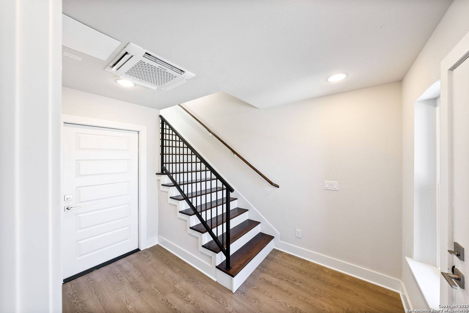 419 Ira Avenue, Unit 2101 San Antonio, TX 78209 - Photo 3 of 23 a view of a hallway with stairs