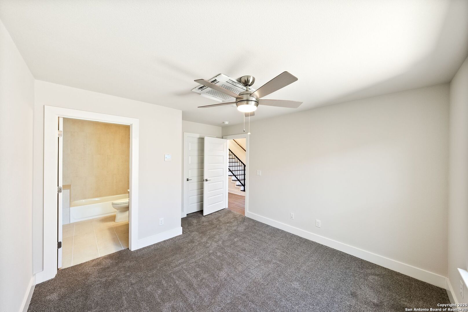 419 Ira Avenue, Unit 2101 San Antonio, TX 78209 - Photo 4 of 23 a view of an empty room and chandelier fan