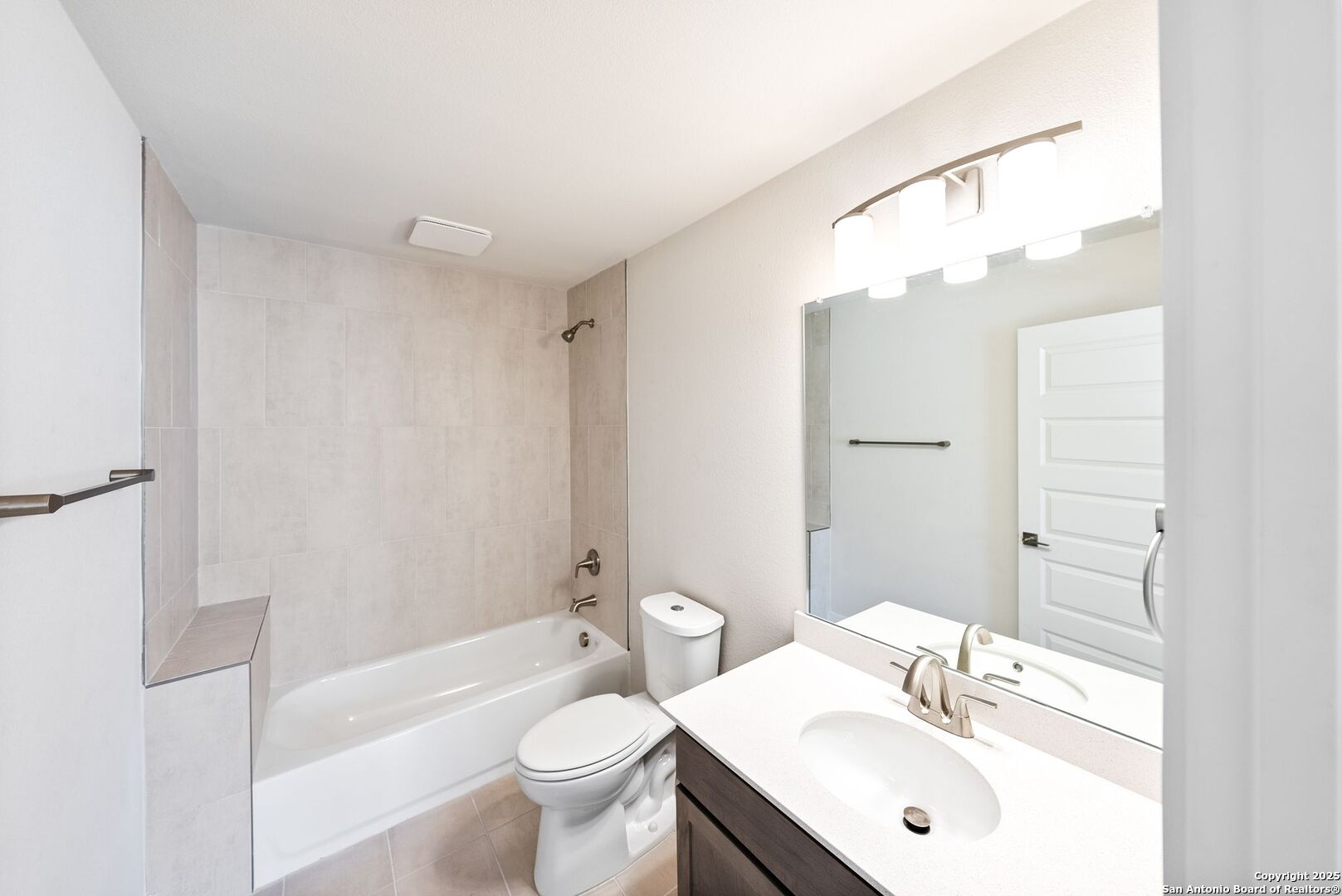 419 Ira Avenue, Unit 2101 San Antonio, TX 78209 - Photo 5 of 23 a bathroom with a sink toilet a mirror and shower