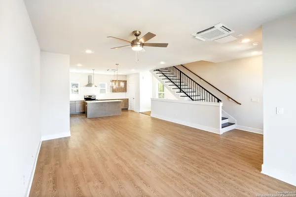 a view of a kitchen with a sink and a stove top oven