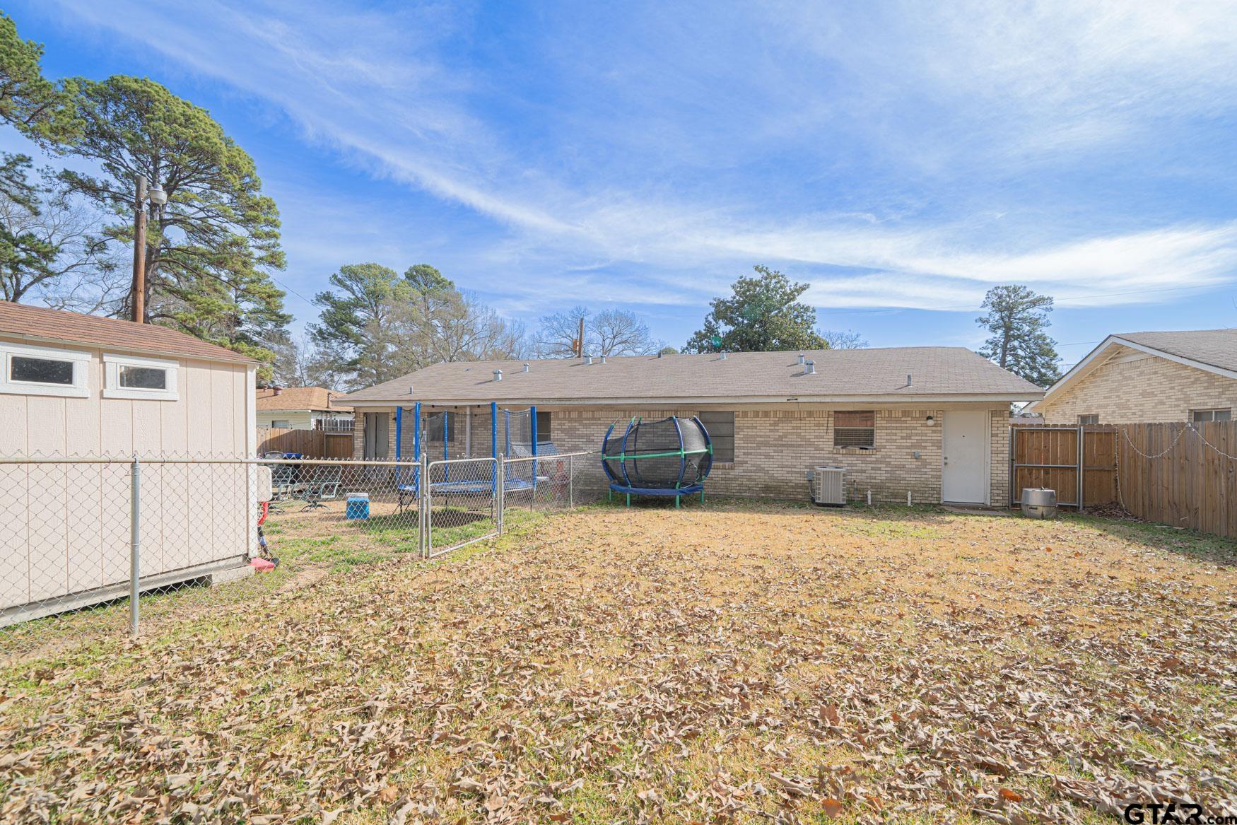 603 Waggoner Street Longview, TX 75604 - Photo 18 of 22 front view of a house with a yard