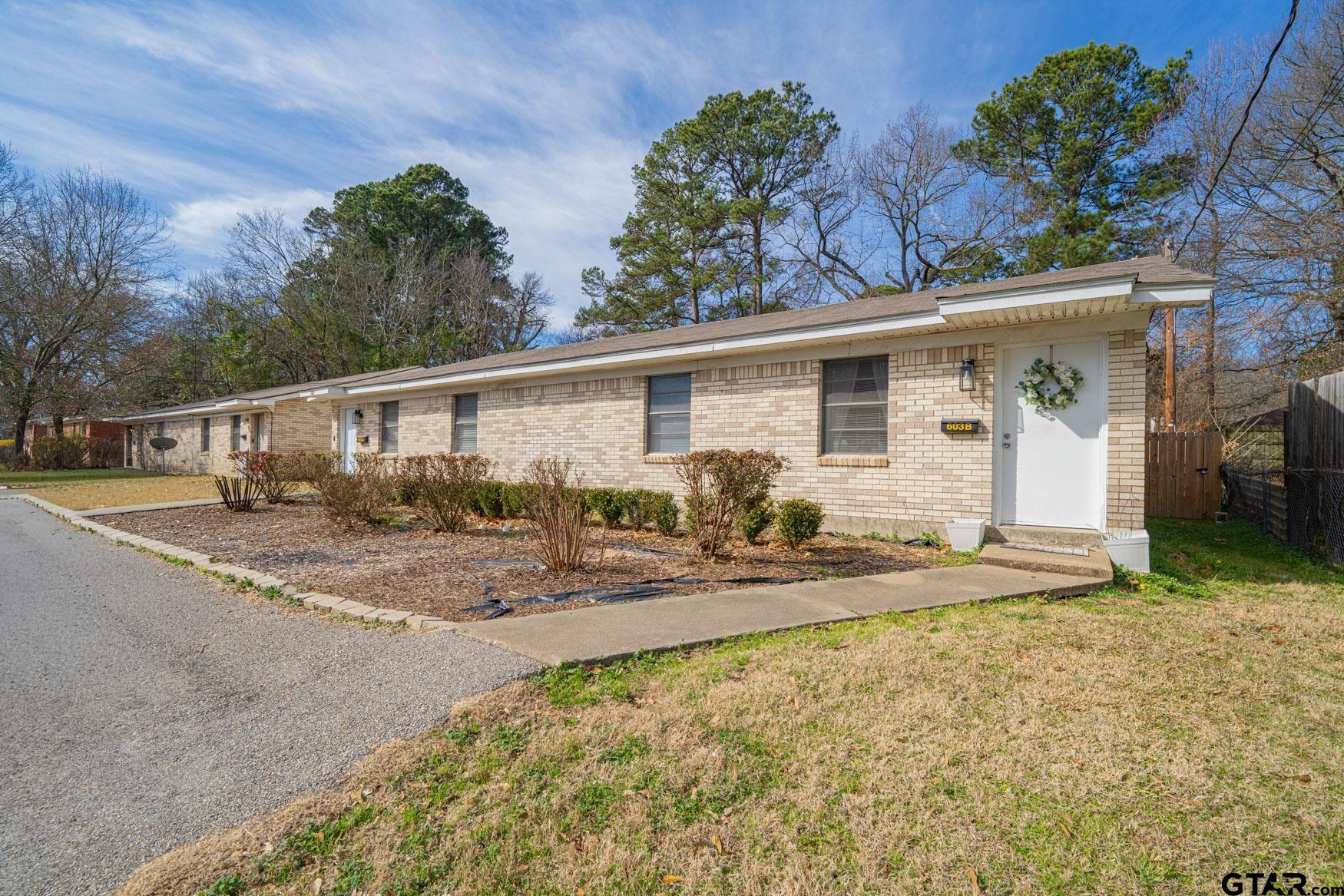 603 Waggoner Street Longview, TX 75604 - Photo 8 of 22 a view of a yard with a house
