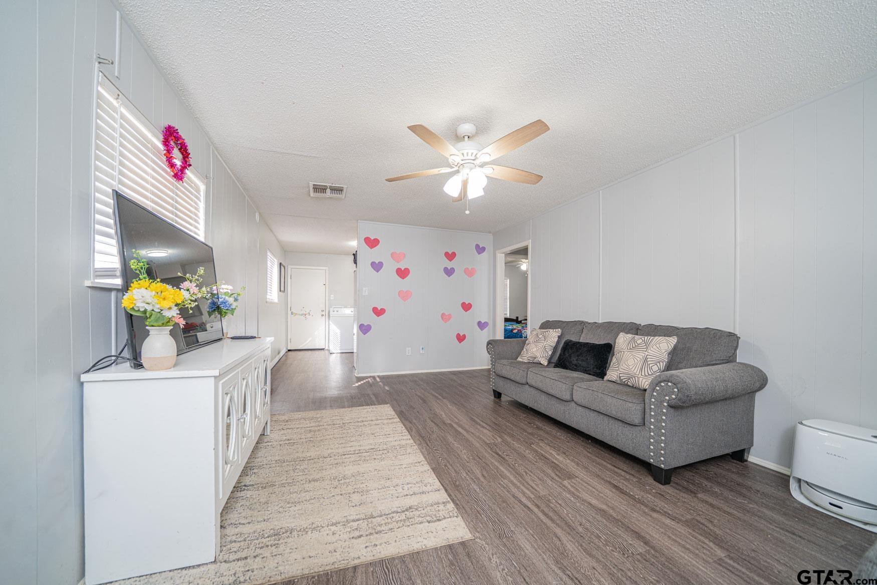 603 Waggoner Street Longview, TX 75604 - Photo 9 of 22 a living room with furniture and wooden floor
