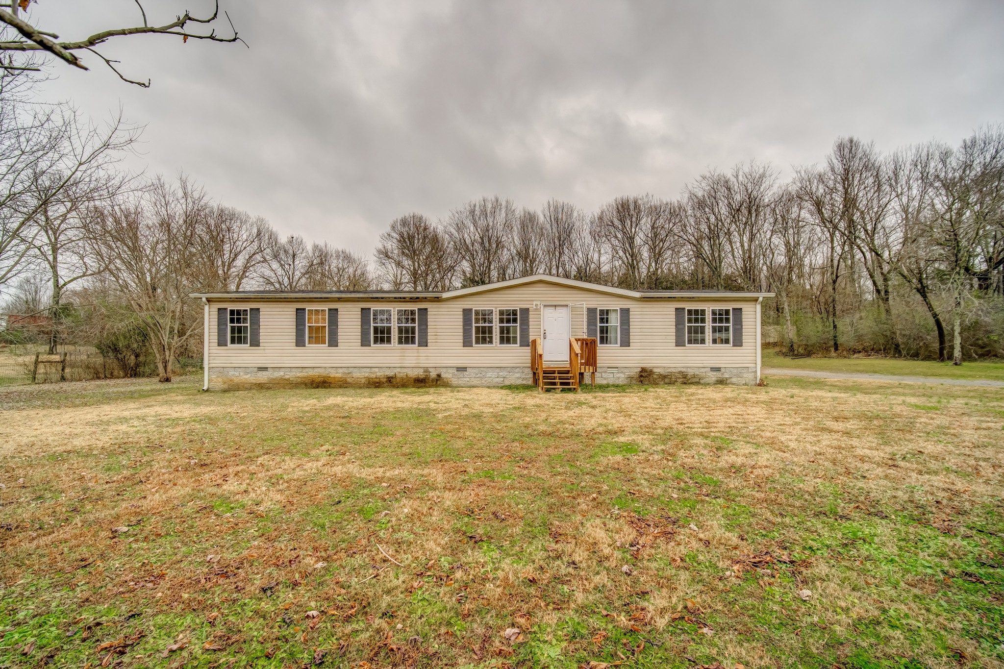 1077 Hamilton Chambers Road Lebanon, TN 37087 - Photo 1 of 29 a front view of house with yard and trees in the background