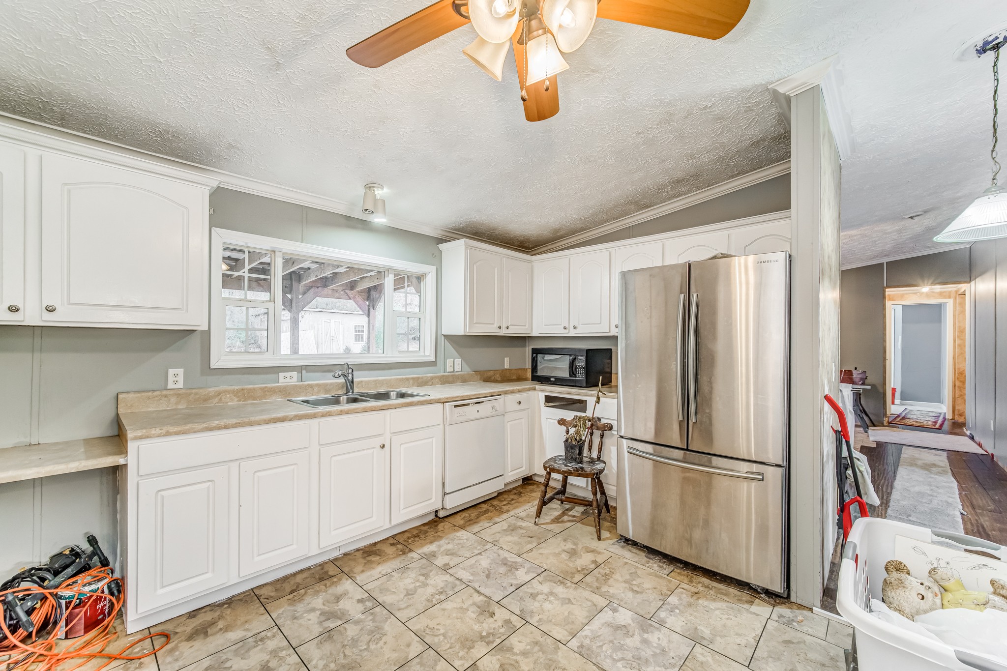 1077 Hamilton Chambers Road Lebanon, TN 37087 - Photo 14 of 29 a kitchen with a sink appliances and cabinets