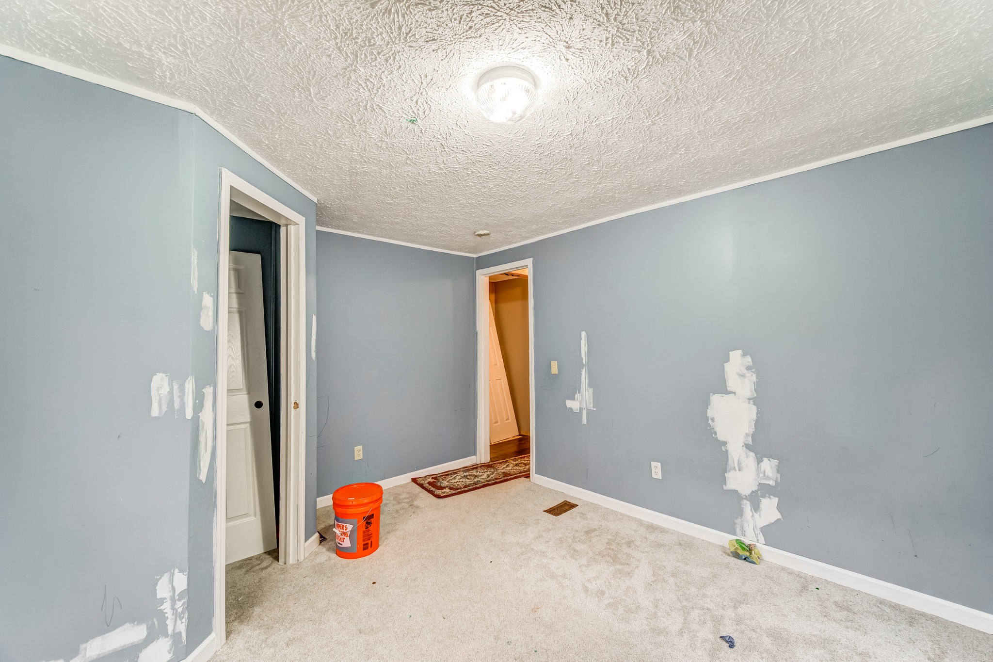 1077 Hamilton Chambers Road Lebanon, TN 37087 - Photo 21 of 29 a bedroom with a bed and a chandelier