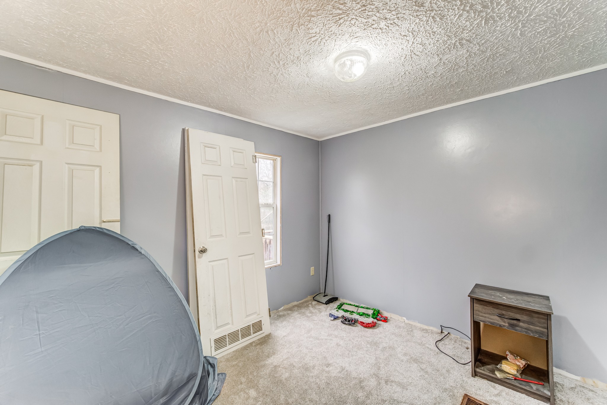 1077 Hamilton Chambers Road Lebanon, TN 37087 - Photo 23 of 29 a bedroom with a bed and a cabinets