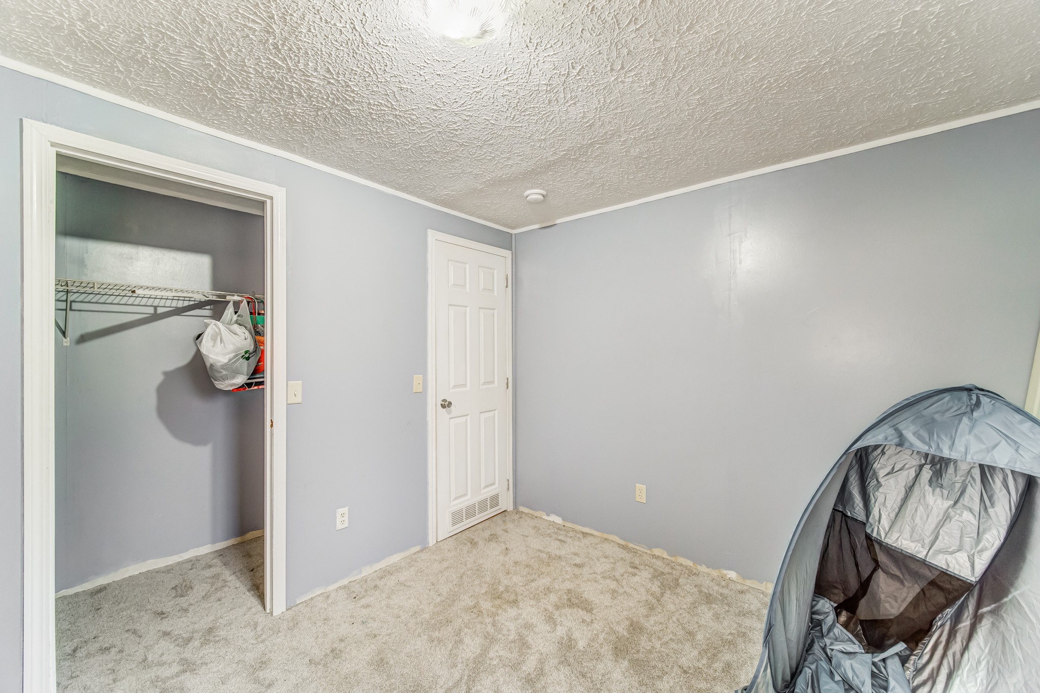 1077 Hamilton Chambers Road Lebanon, TN 37087 - Photo 24 of 29 a view of a livingroom with wooden floor and a hallway