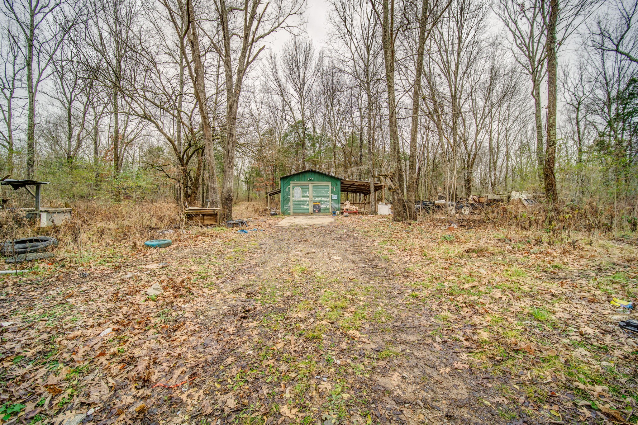 1077 Hamilton Chambers Road Lebanon, TN 37087 - Photo 7 of 29 a backyard of a house with large trees and outdoor seating