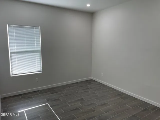 an empty room with a empty space and window