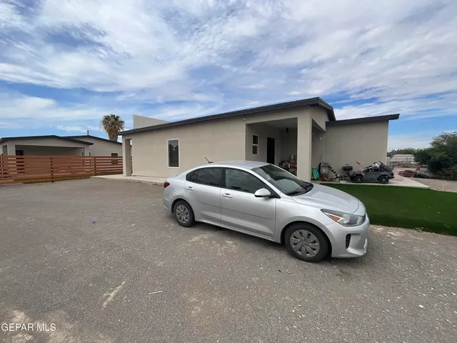 a car parked in front of a house