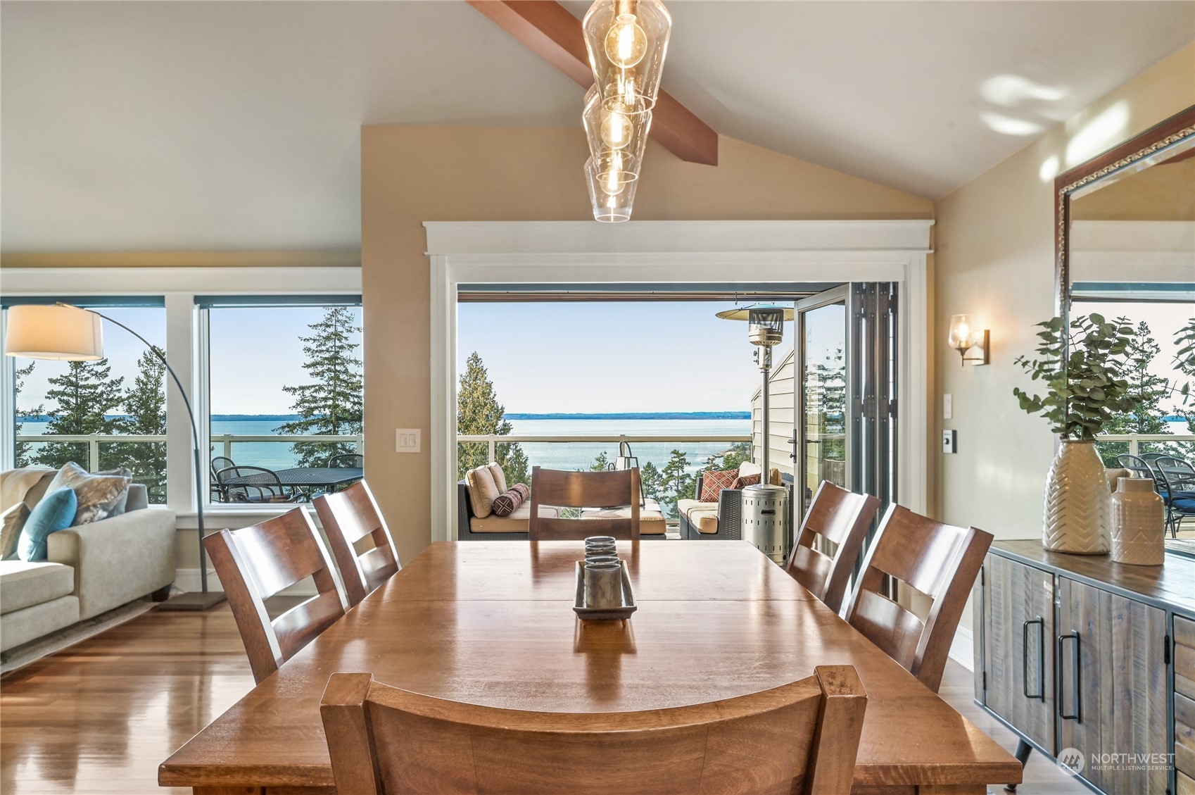 711 Briar Road Bellingham, WA 98225 - Photo 9 of 40 a view of a dining room with furniture large windows and wooden floor
