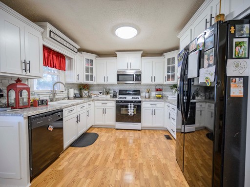 835 Spike Trail Murfreesboro, TN 37129 - Photo 6 of 24 a kitchen with stainless steel appliances granite countertop a refrigerator sink and cabinets