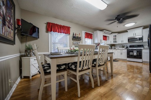 835 Spike Trail Murfreesboro, TN 37129 - Photo 9 of 24 a dining area with stainless steel appliances kitchen island granite countertop a dining table chairs and a refrigerator