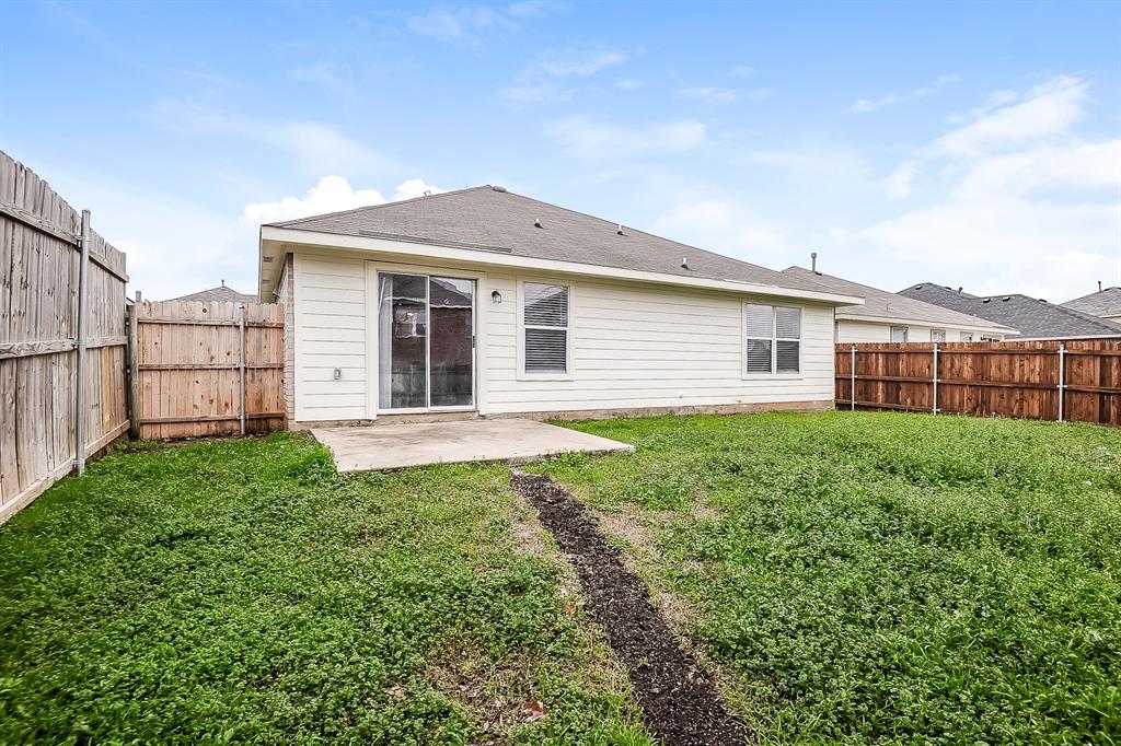 7417 Snow Ridge Drive Fort Worth, TX 76133 - Photo 15 of 16 a view of a house with yard and a garden
