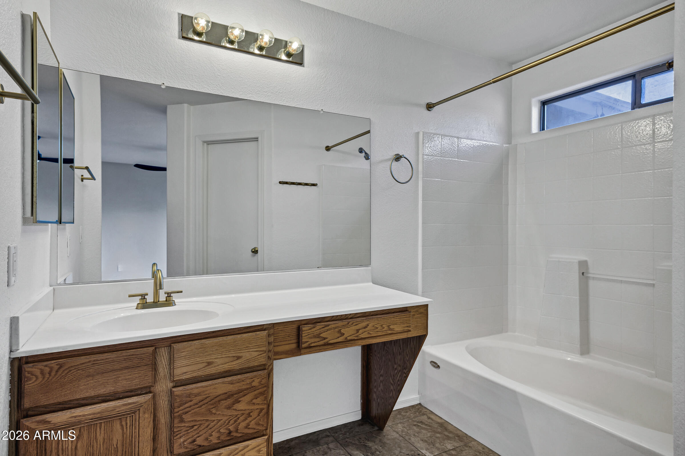 56 South Monterey Street Gilbert, AZ 85233 - Photo 24 of 30 a bathroom with a sink double vanity granite tub shower and a mirror