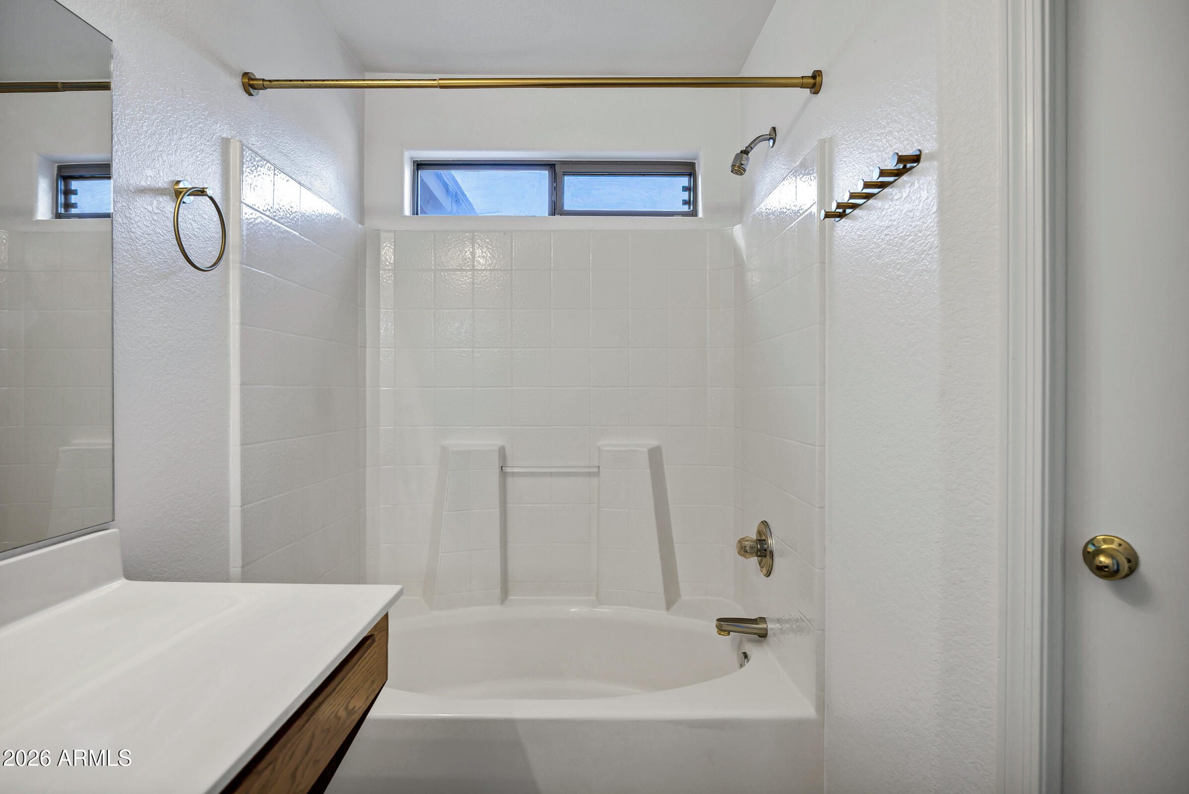 56 South Monterey Street Gilbert, AZ 85233 - Photo 25 of 30 a bathroom with a bathtub and shower