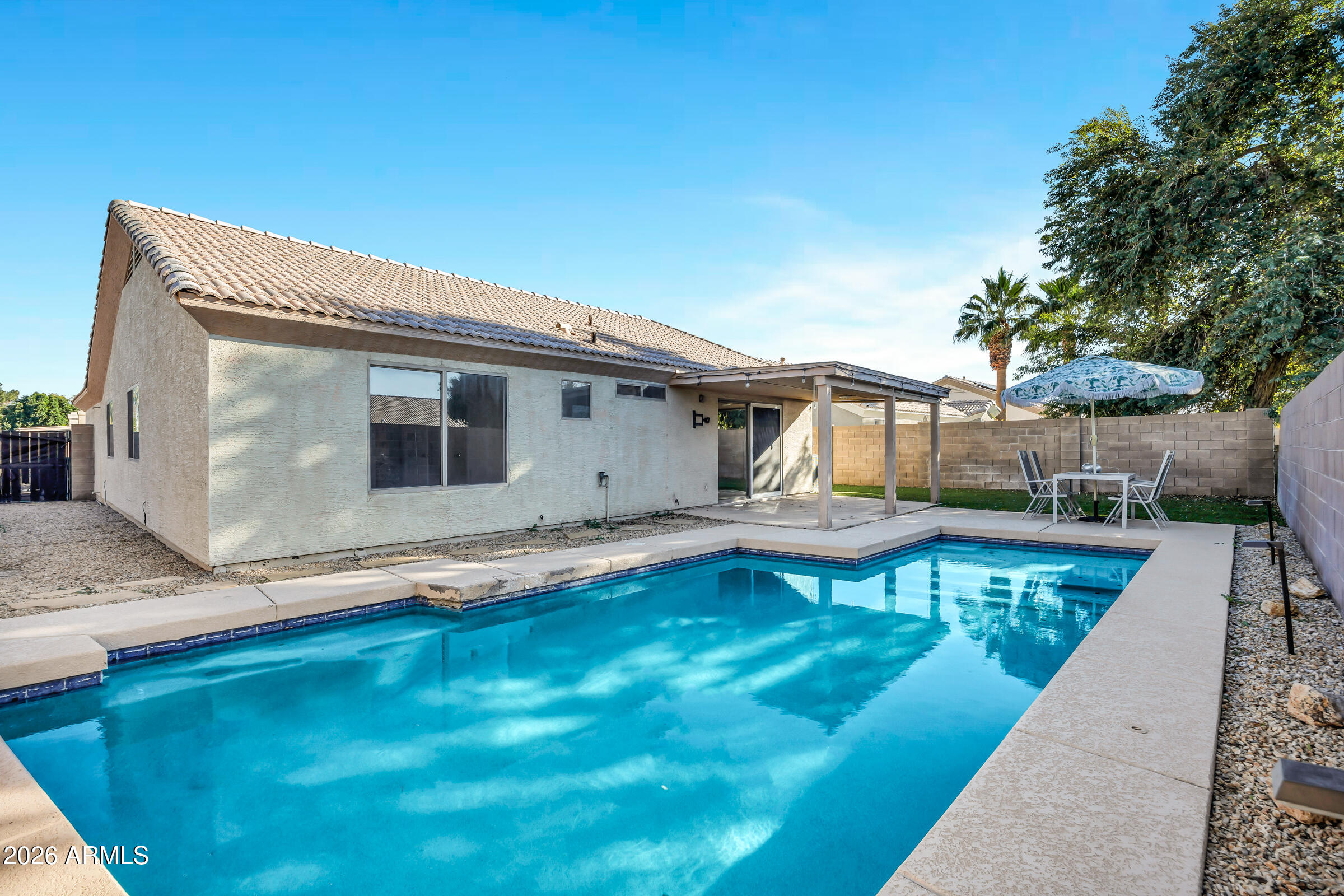 56 South Monterey Street Gilbert, AZ 85233 - Photo 27 of 30 a view of a house with pool and sitting area