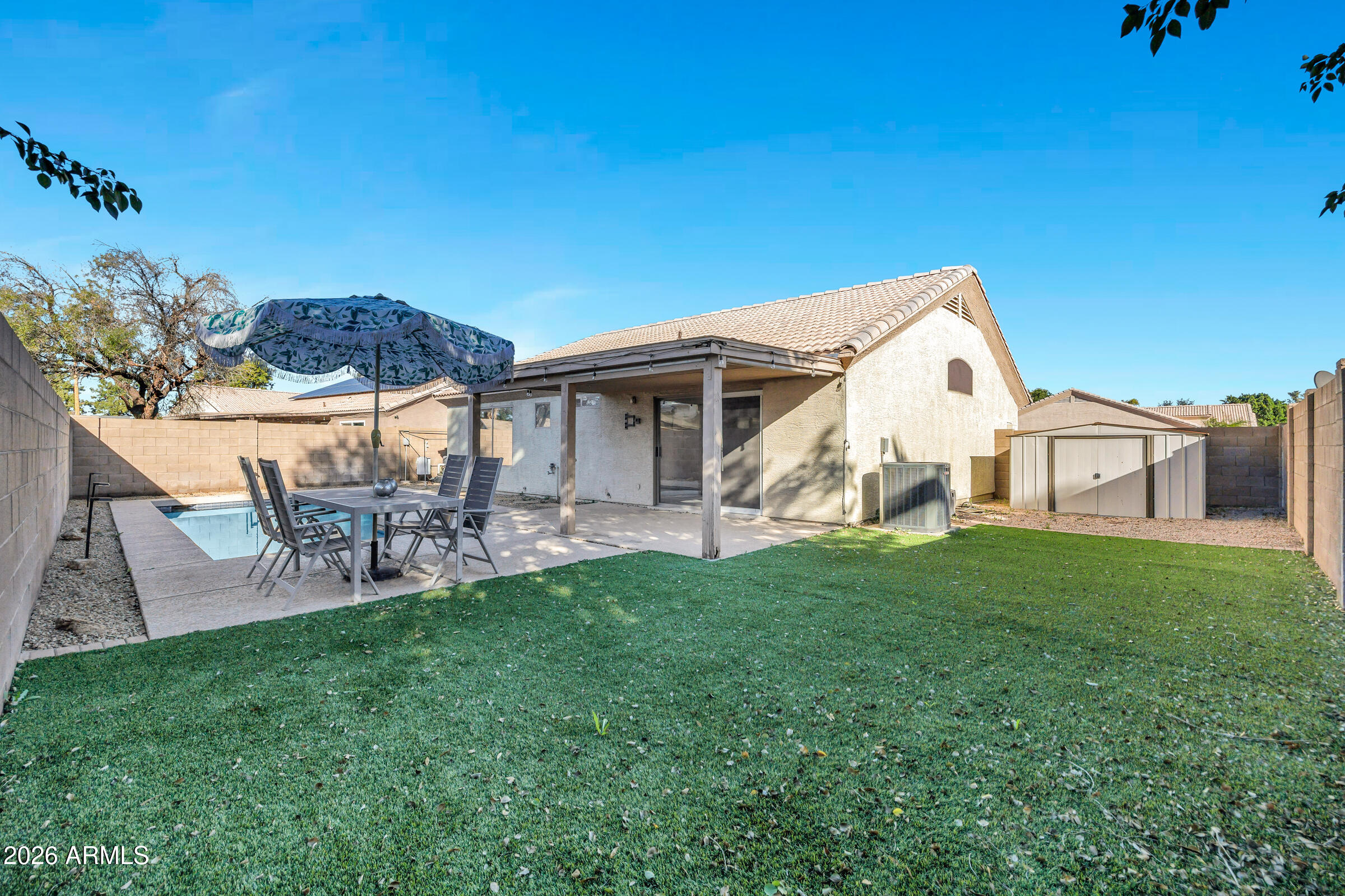 56 South Monterey Street Gilbert, AZ 85233 - Photo 29 of 30 a view of a house with a yard and sitting area