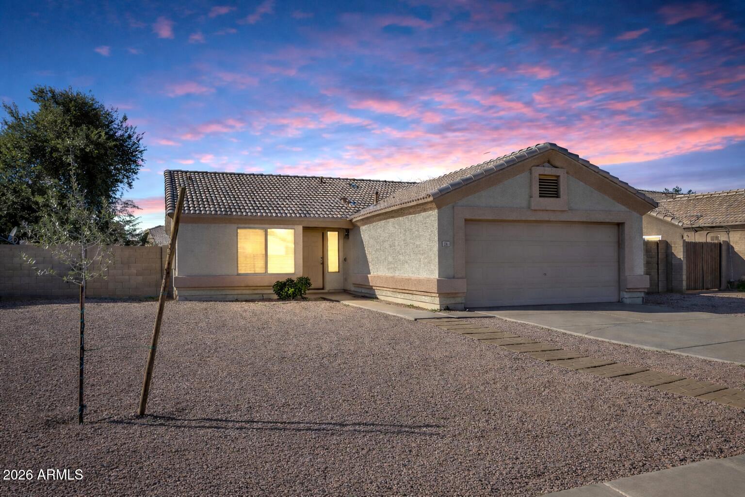 56 South Monterey Street Gilbert, AZ 85233 - Photo 4 of 30 a front view of a house with a yard and garage