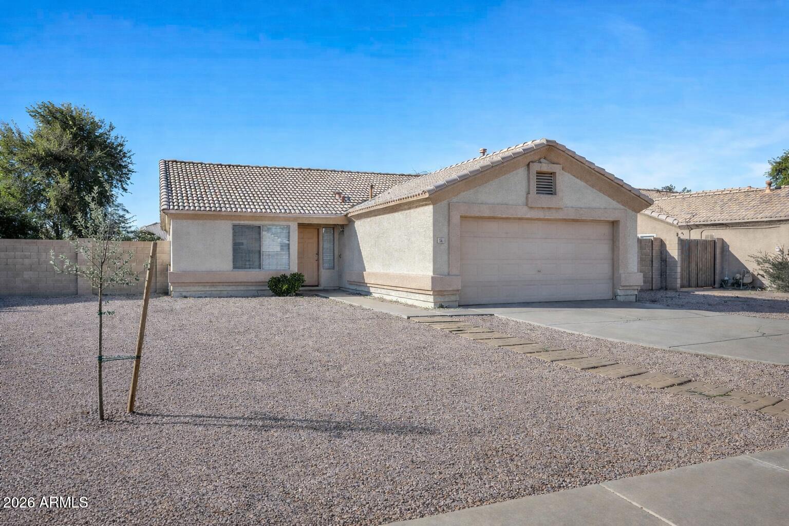 56 South Monterey Street Gilbert, AZ 85233 - Photo 5 of 30 a front view of a house with a yard