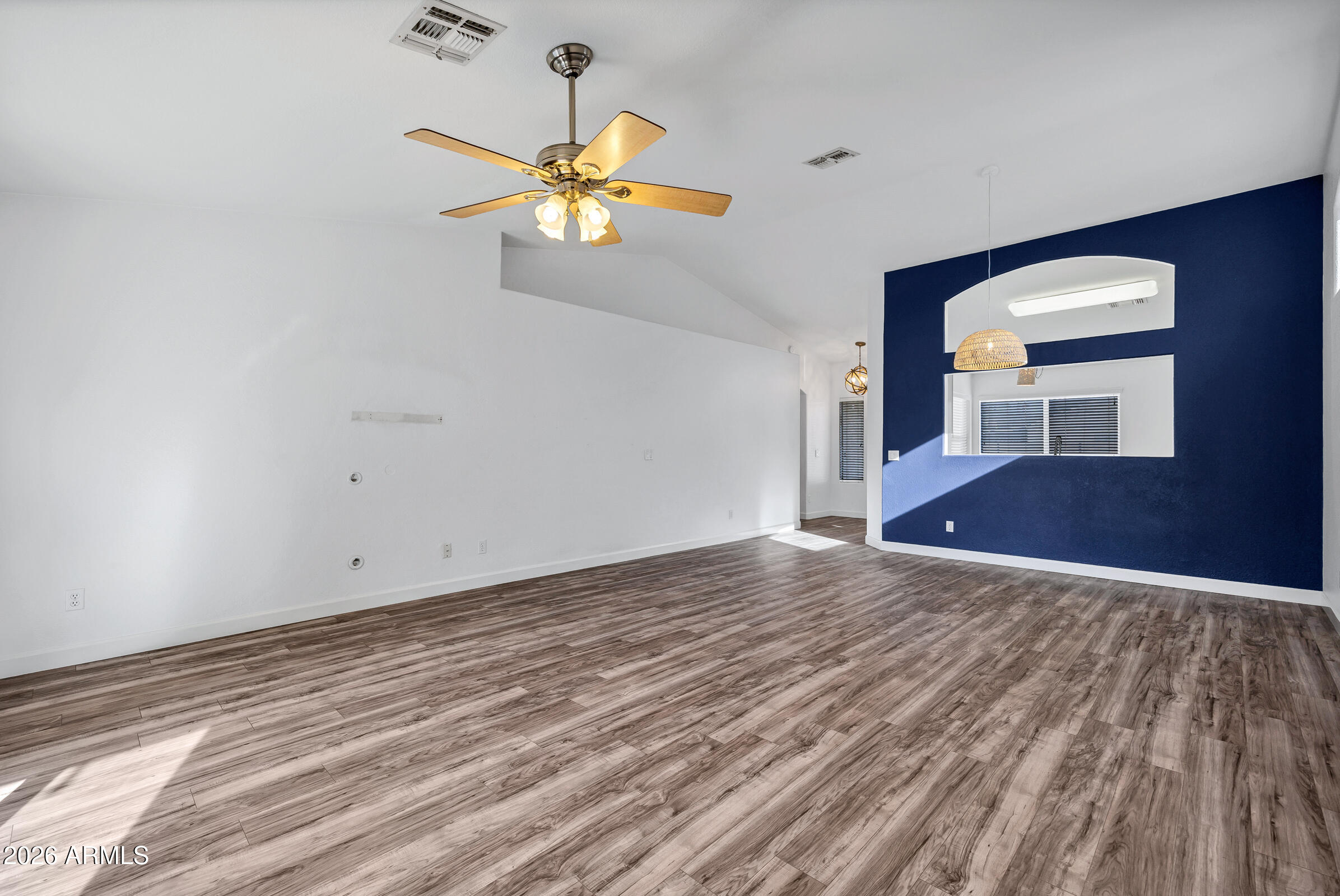 56 South Monterey Street Gilbert, AZ 85233 - Photo 9 of 30 a view of empty room with wooden floor and fan