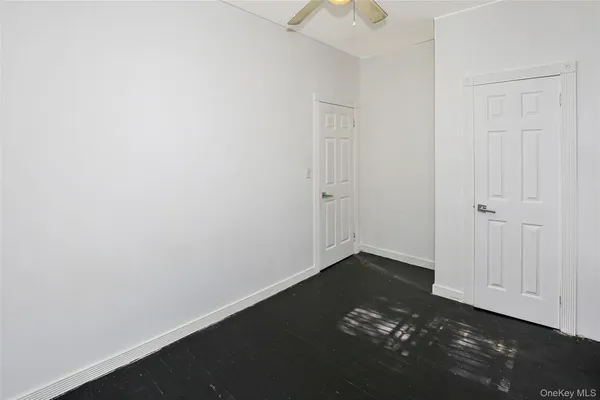 an empty room with a hard wood floor