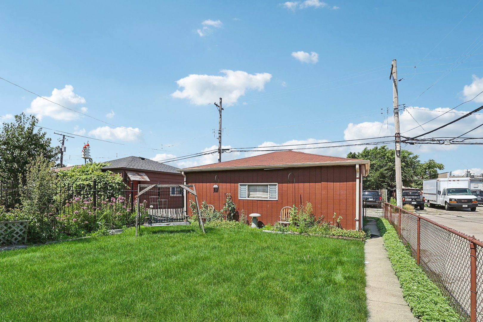6014 West Fletcher Street Chicago, IL 60634 - Photo 21 of 28 a front view of a house with garden