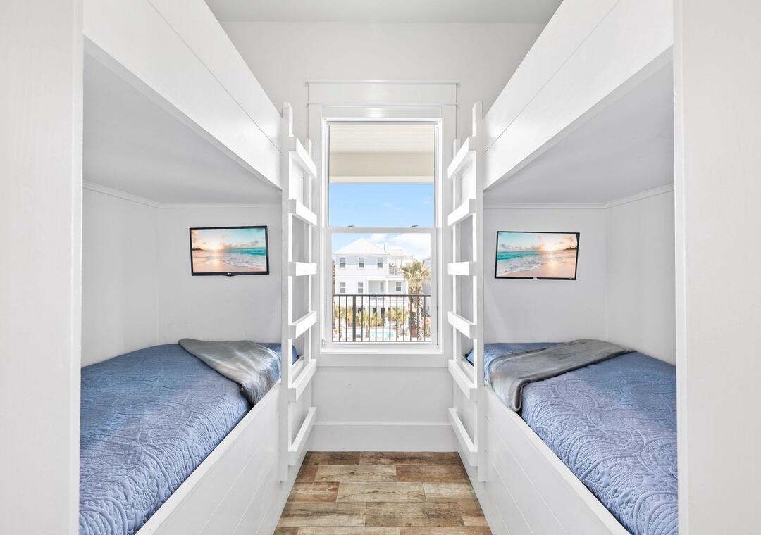 151 Snowdrift Road Miramar Beach, FL 32550 - Photo 23 of 50 a spacious bedroom with a bed and a chandelier