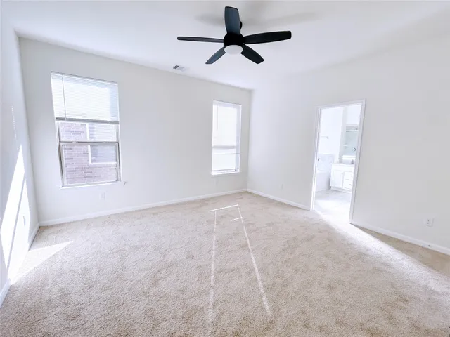 a kitchen with a sink a microwave a stove and cabinets