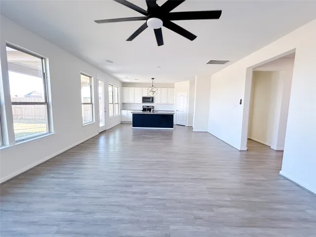 a view of empty room with windows