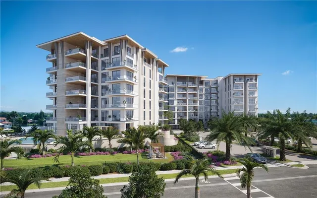 a view of a building with a yard and potted plants