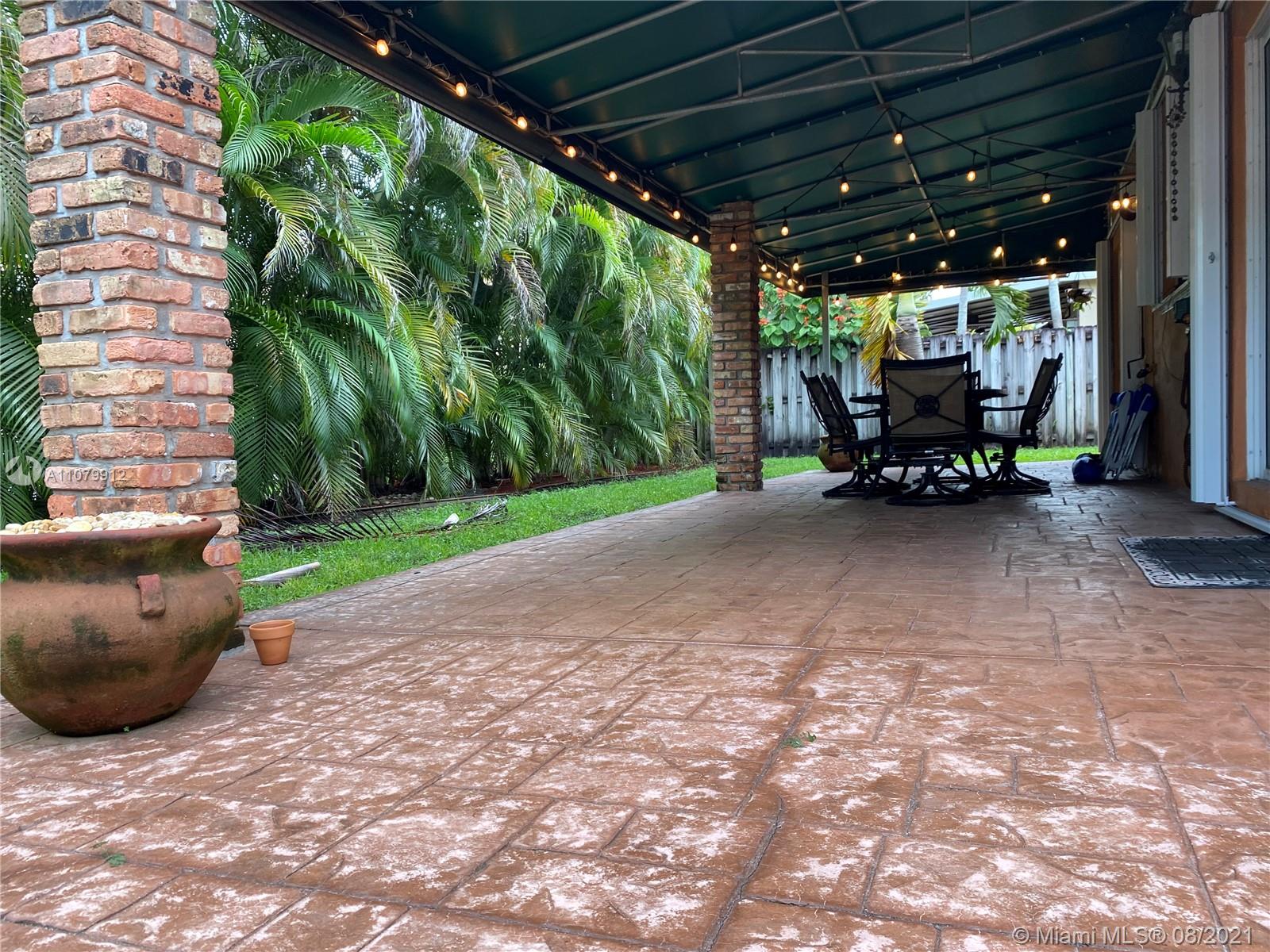 West Kendall Miami, FL 33193 - Photo 4 of 8 a view of a patio with a table and chairs