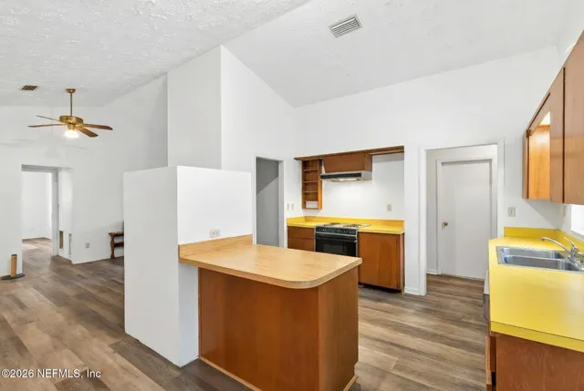 a kitchen with a stove a refrigerator and a stove