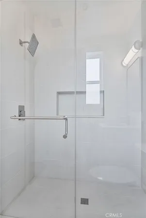 a bathroom with a toilet sink vanity and mirror