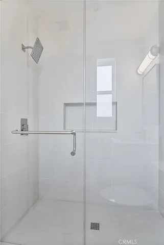 a bathroom with a toilet sink vanity and mirror