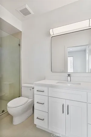 a bathroom with a bathtub and a toilet