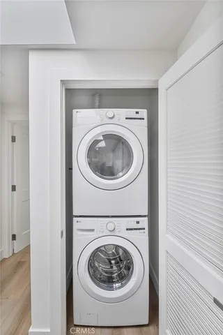 a view of a backyard with white walls