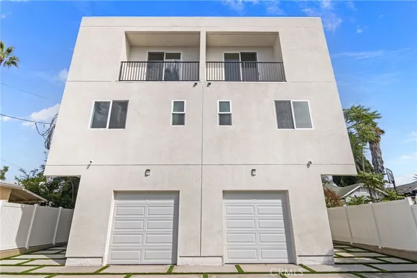 a view of a potted plants on a floor in front of house