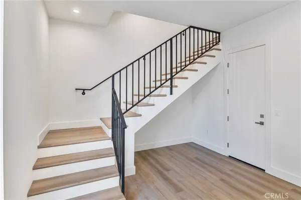 a view of entryway with wooden floor