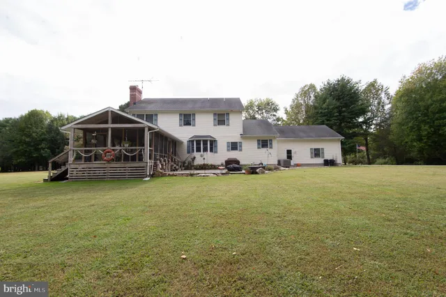 a front view of house with yard and seating area