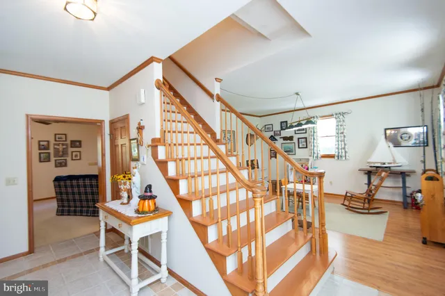 a view of an entryway and wooden floor