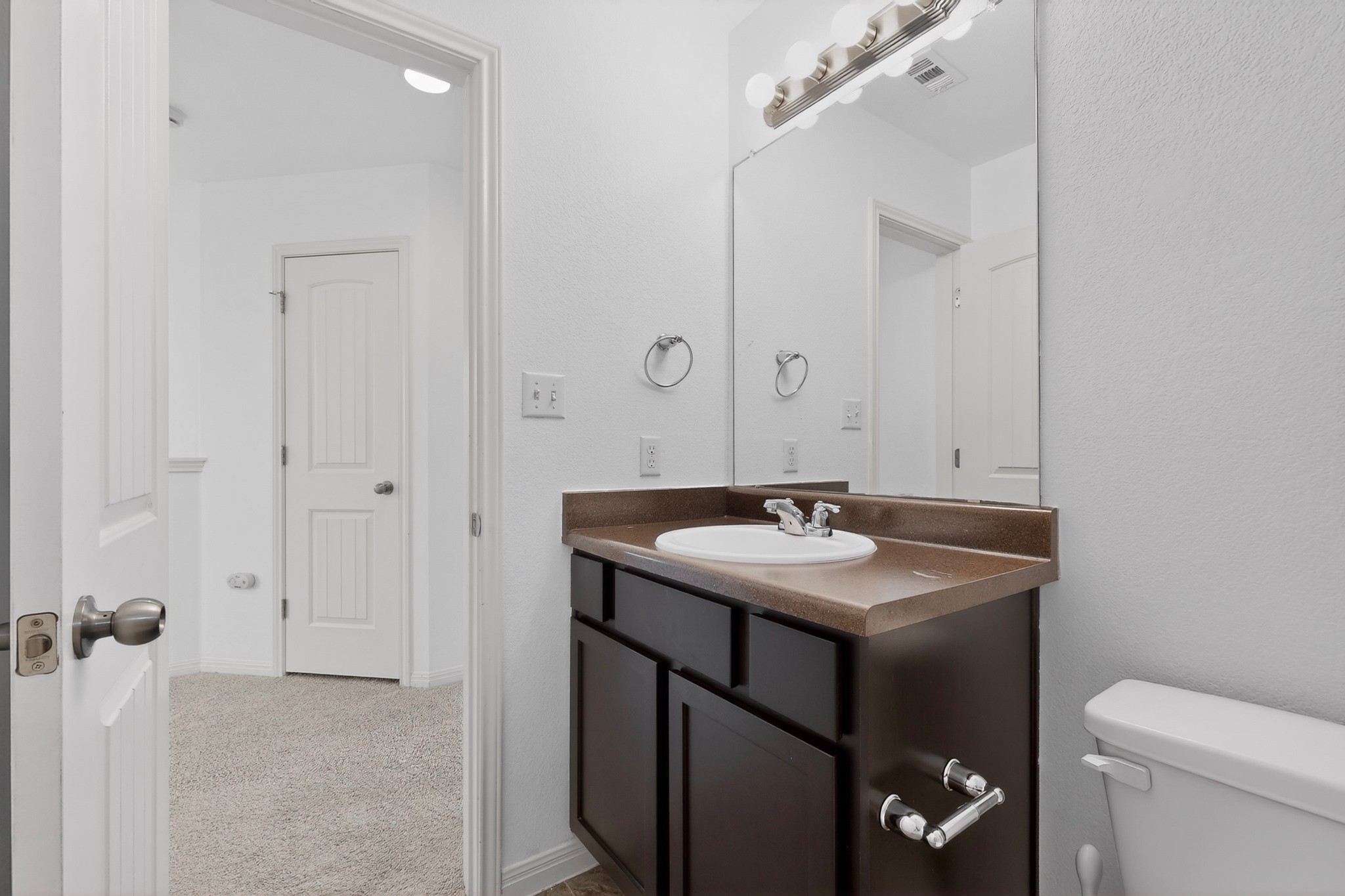4619 Inicio Lane Austin, TX 78725 - Photo 25 of 32 a bathroom with a sink and a toilet